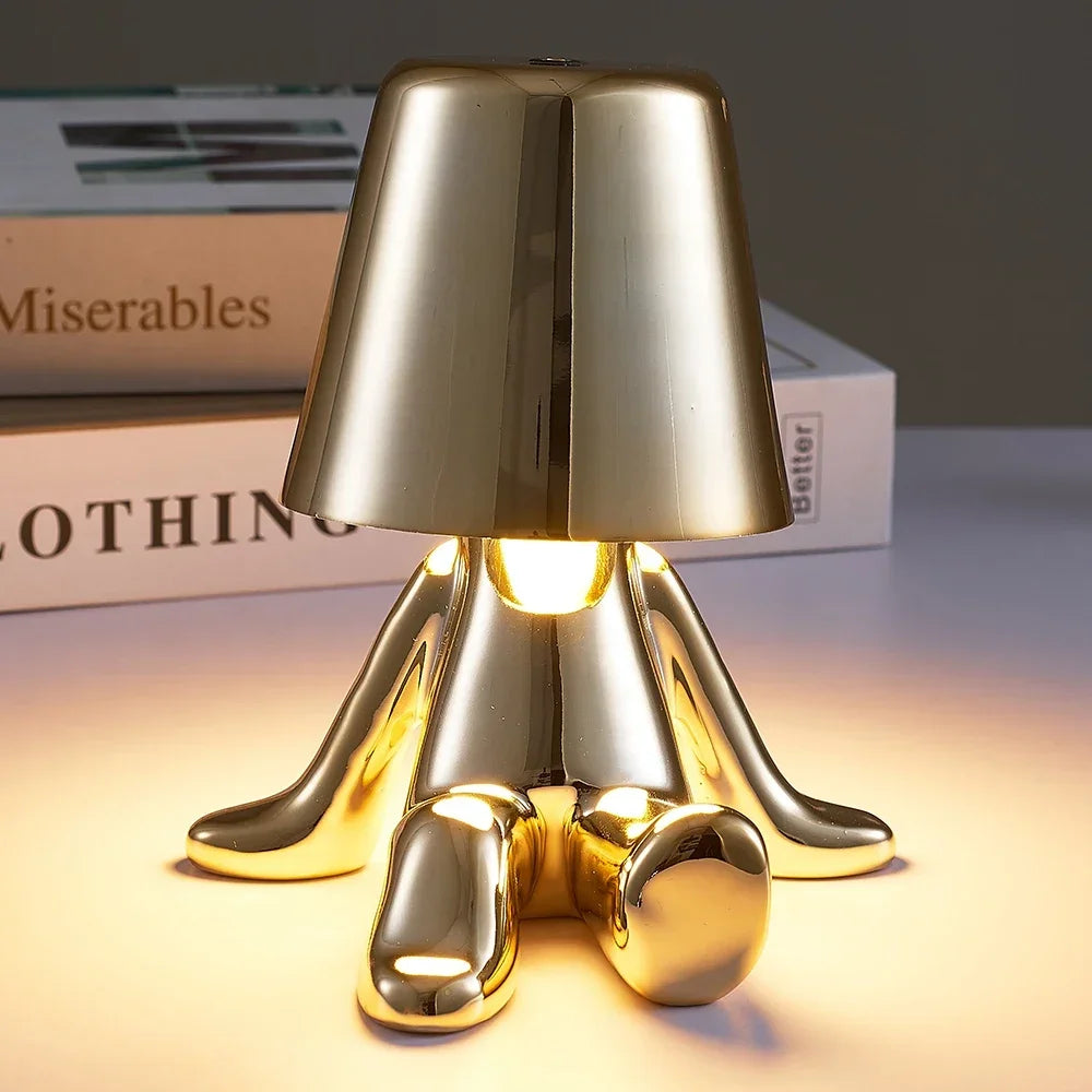 Lampe de chevet design petit bonhomme en métal tactile or et argent