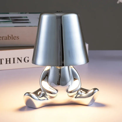 Lampe de chevet design petit bonhomme en métal tactile or et argent