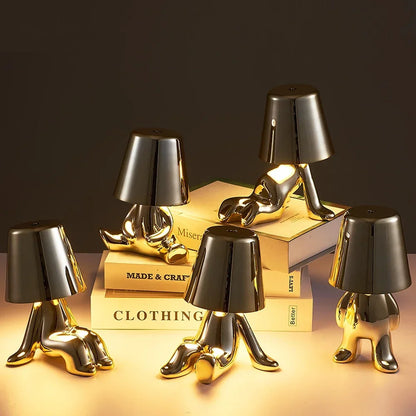 Lampe de chevet design petit bonhomme en métal tactile or et argent